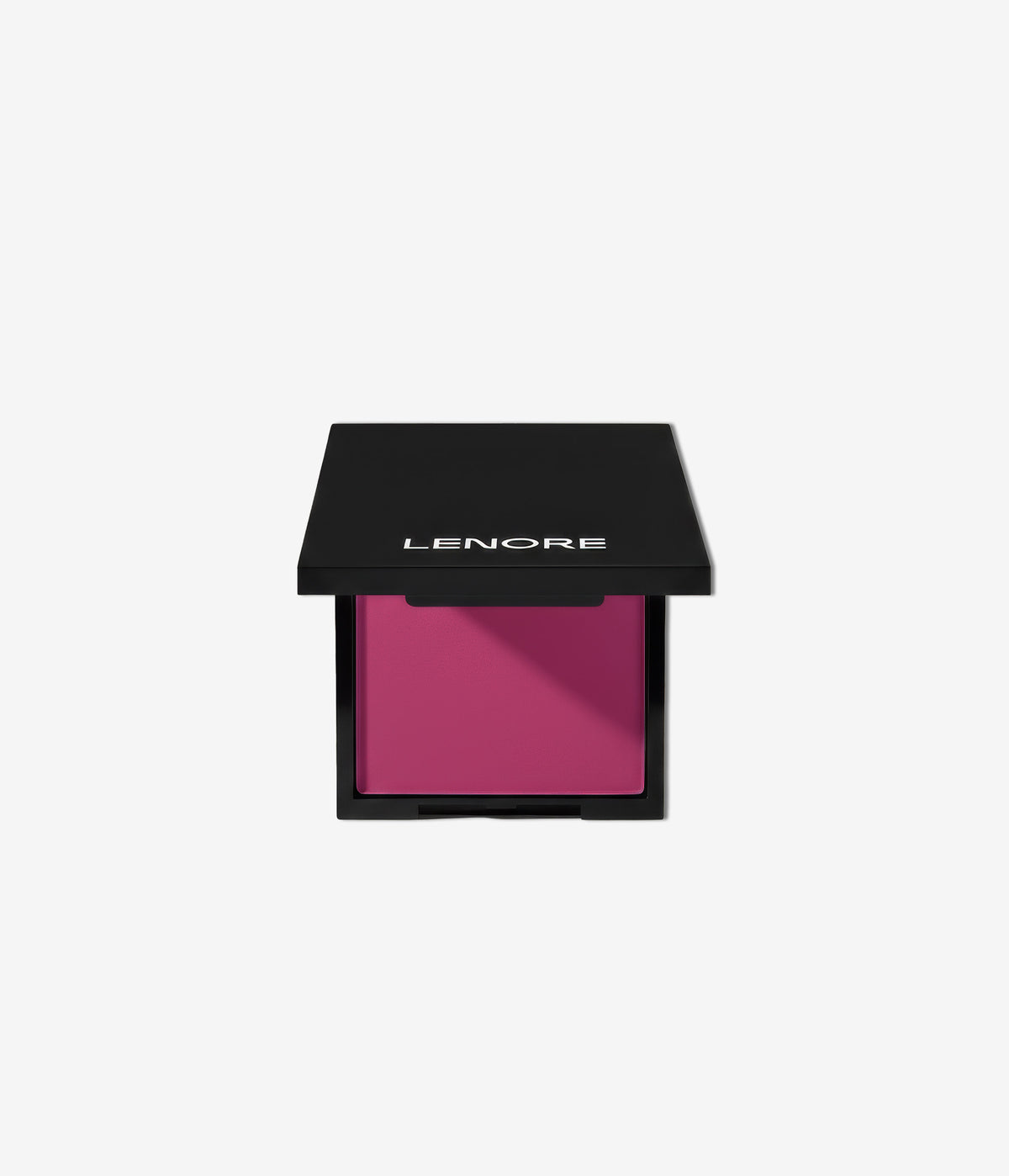 Dark pink purple makeup compact with black lid on a white background