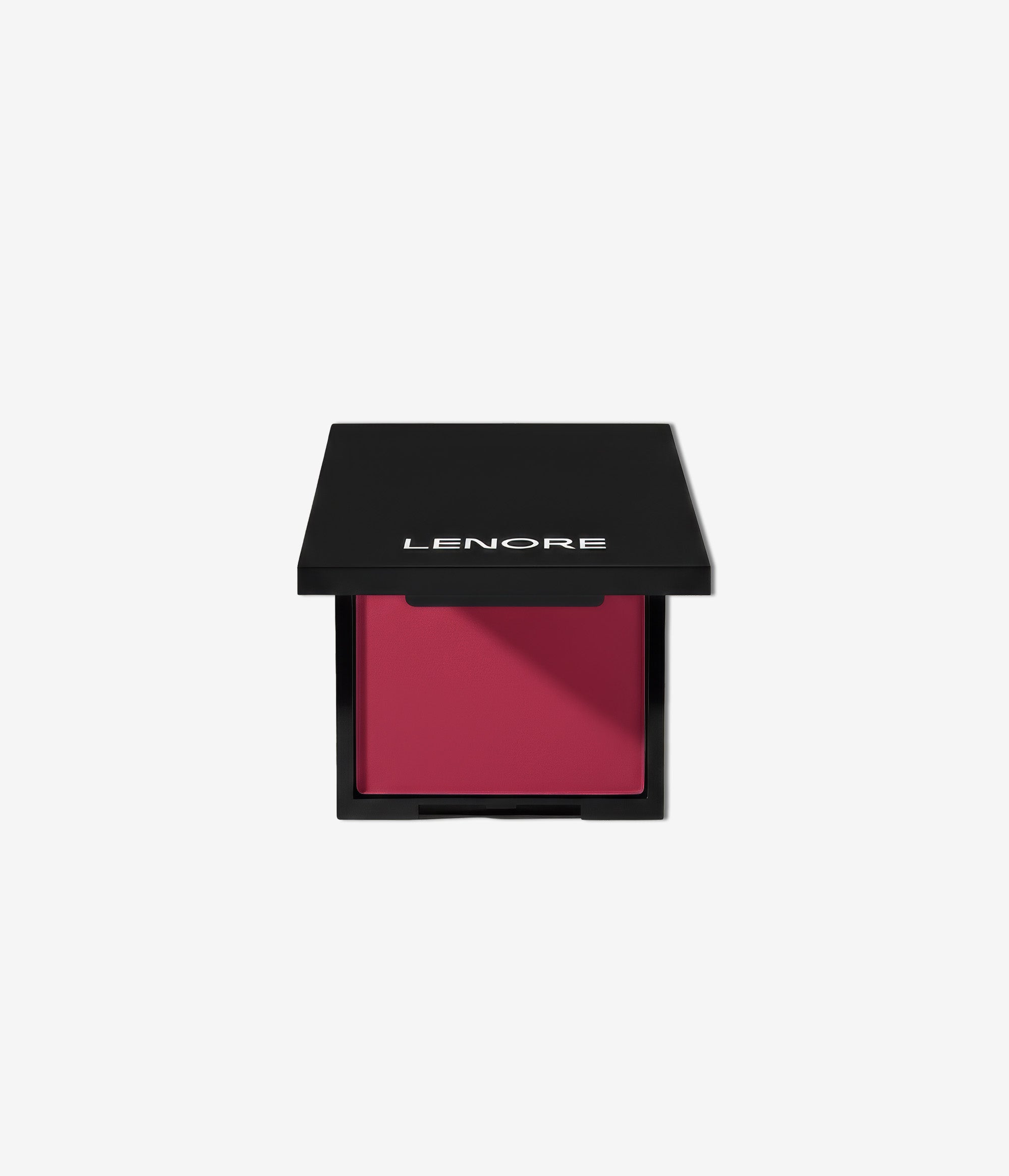 Pink blush in a black compact with 'Lenore' branding on a light gray background